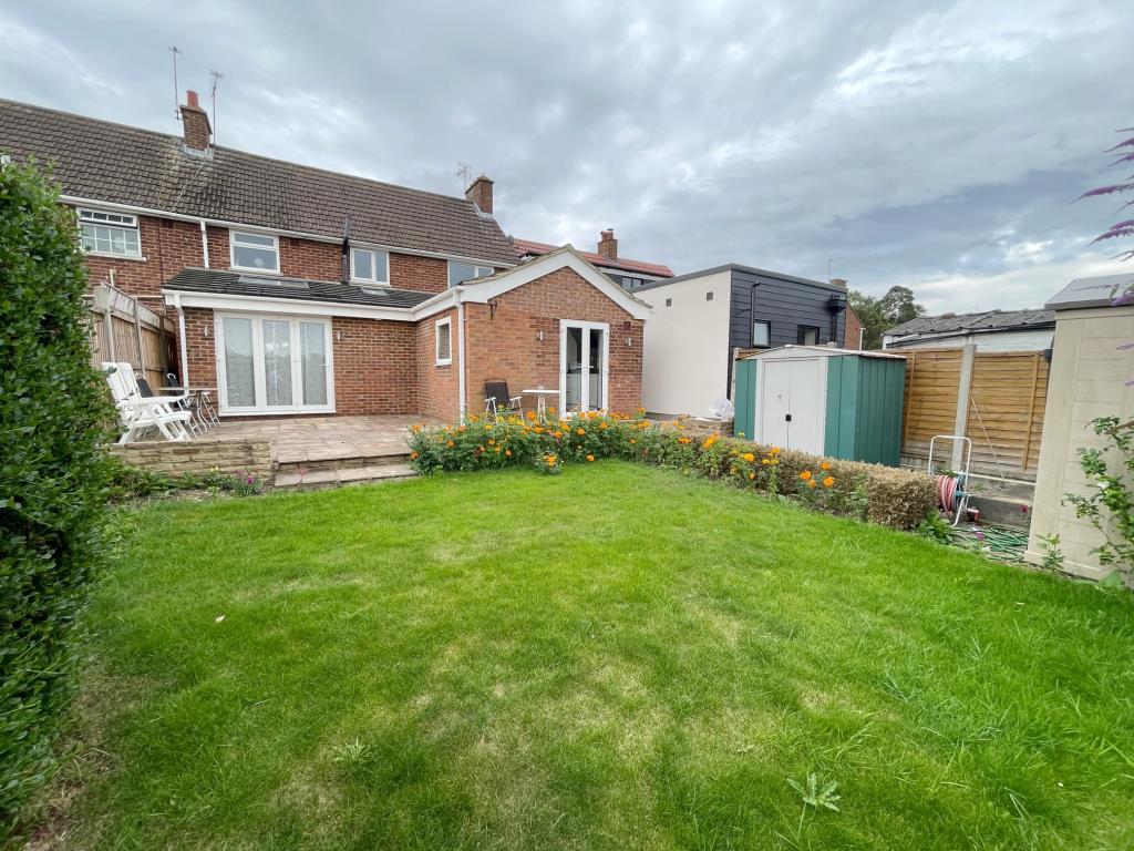 Lot: 57 - THREE-BEDROOM TERRACE HOUSE FOR REPAIR IN POPULAR ESSEX VILLAGE - rear garden and extension to the rear